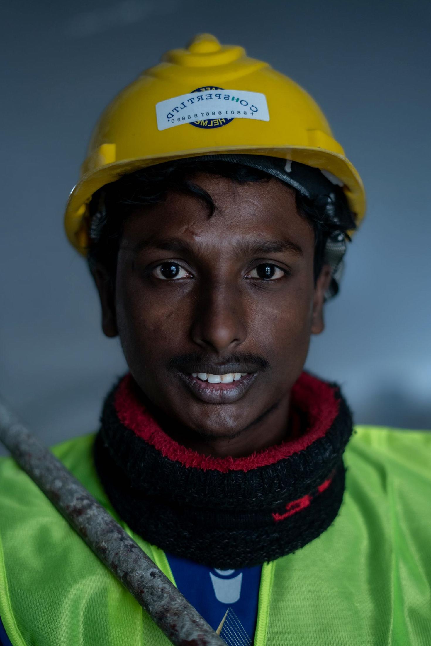 Construction worker wearing a hard hat and safety vest
