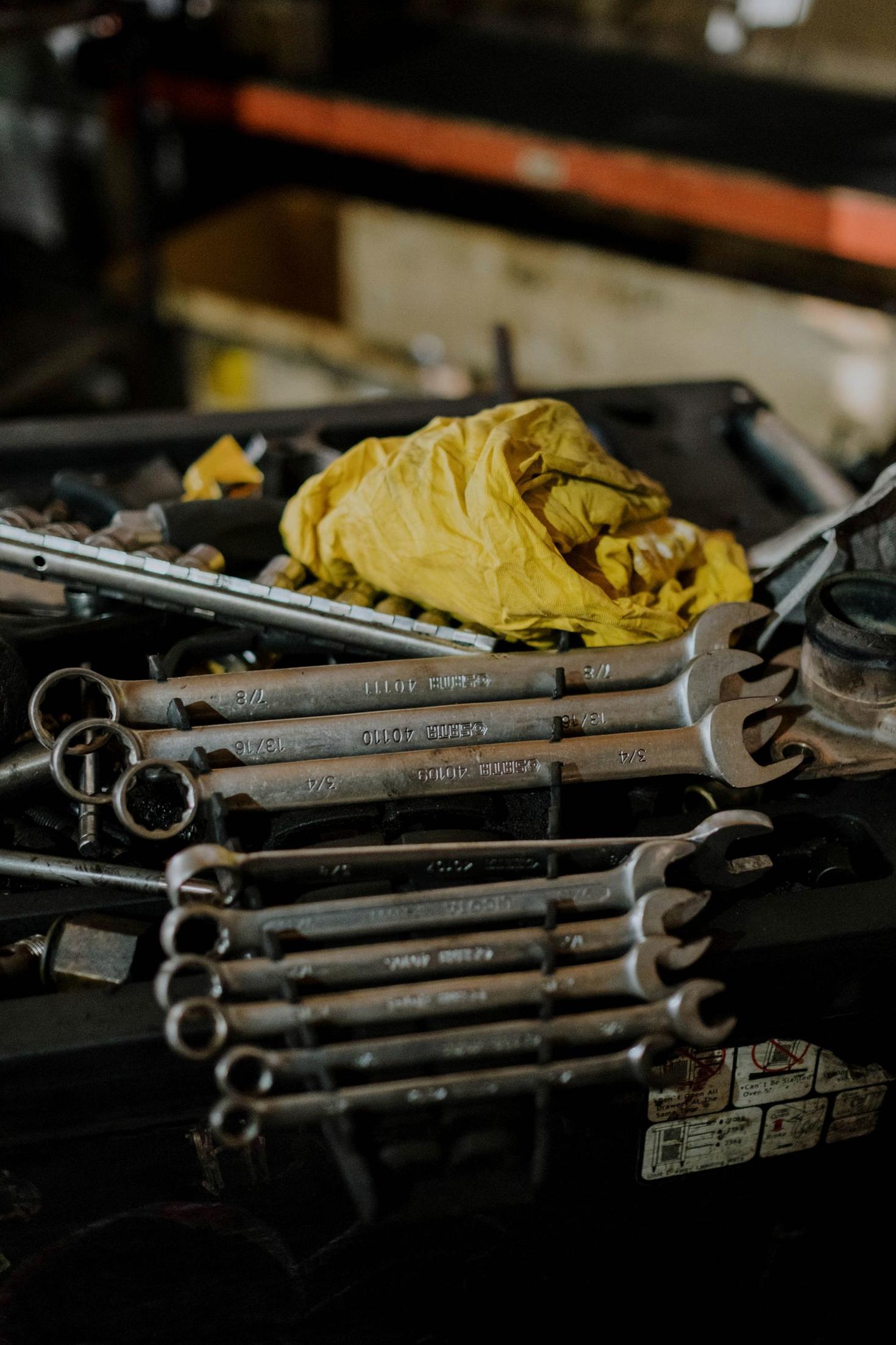 Combination wrenches on a workbench